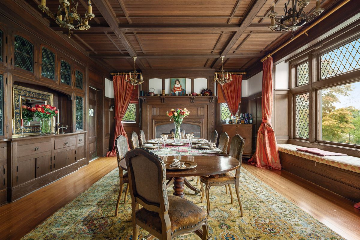 Dining room with coffered wood ceiling, fireplace and built in cabinetry at 184 Upper Mountain Avenue