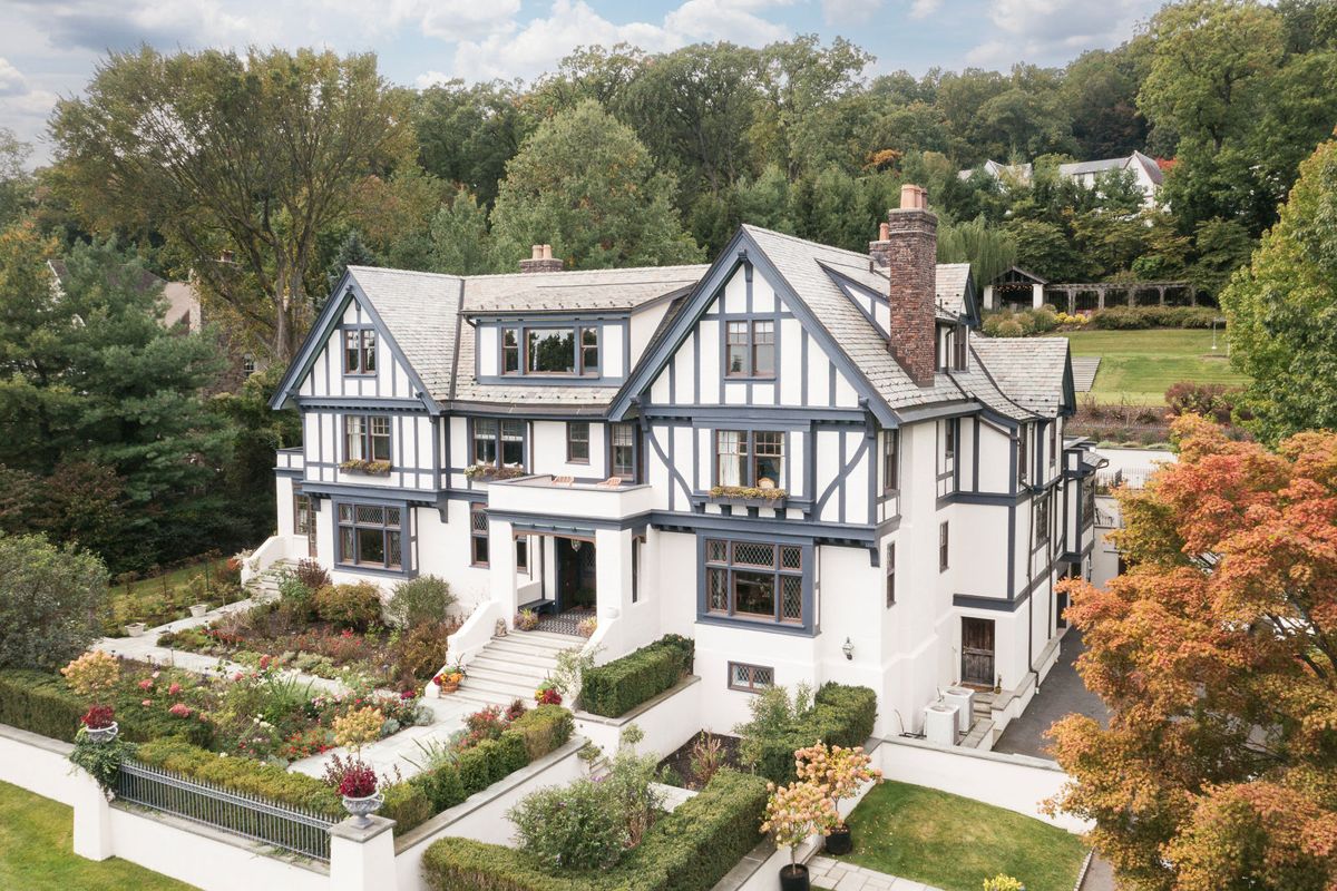 Aerial view of the front gardens and terraces of 184 Upper Mountain Avenue in early autumn