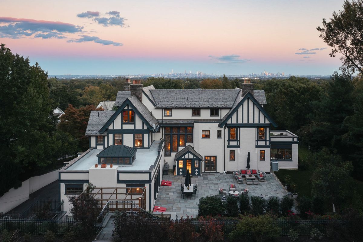 Elevated dusk view over the bluestone patio toward the rear of 184 Upper Mountain Avenue