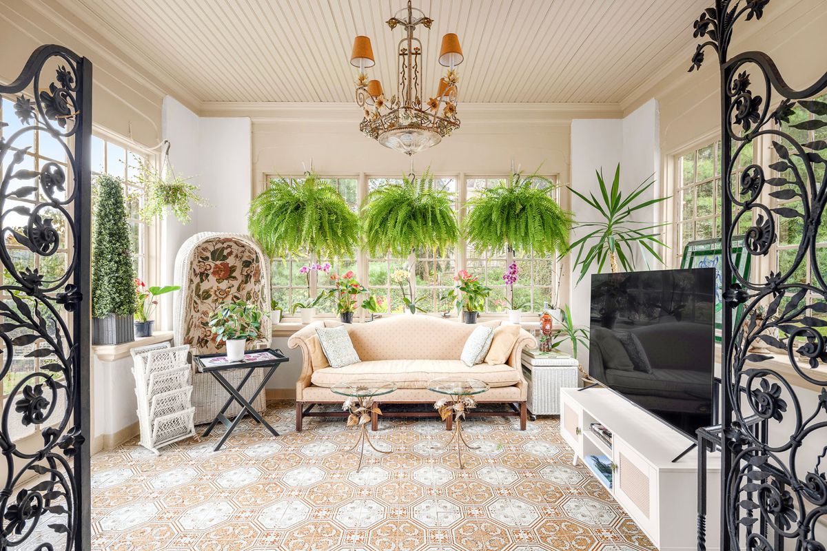 Solarium with wrought iron doors, leaded transoms and patterned tile at 184 Upper Mountain Avenue