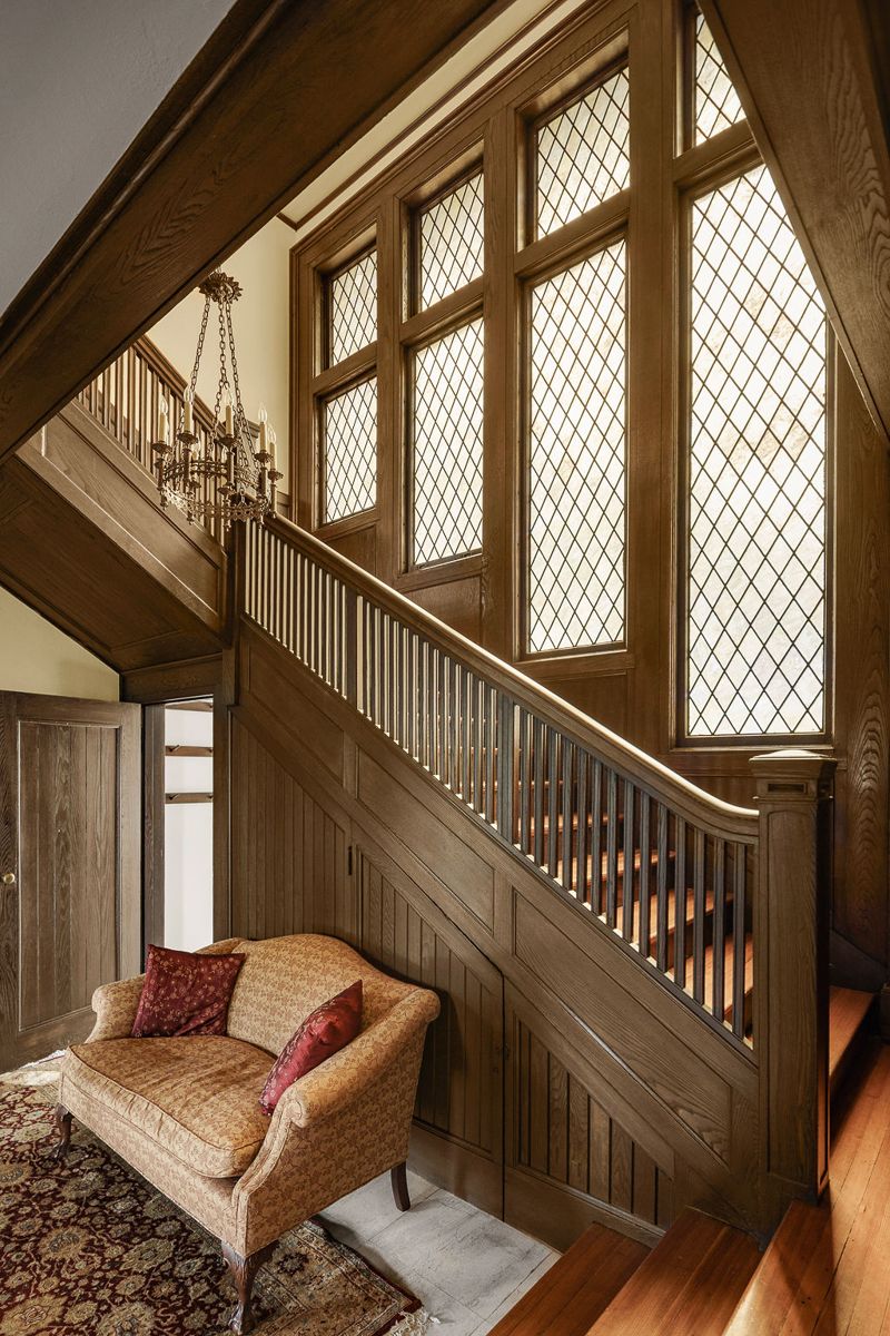 Leaded glass windows above the carved staircase at 184 Upper Mountain Avenue